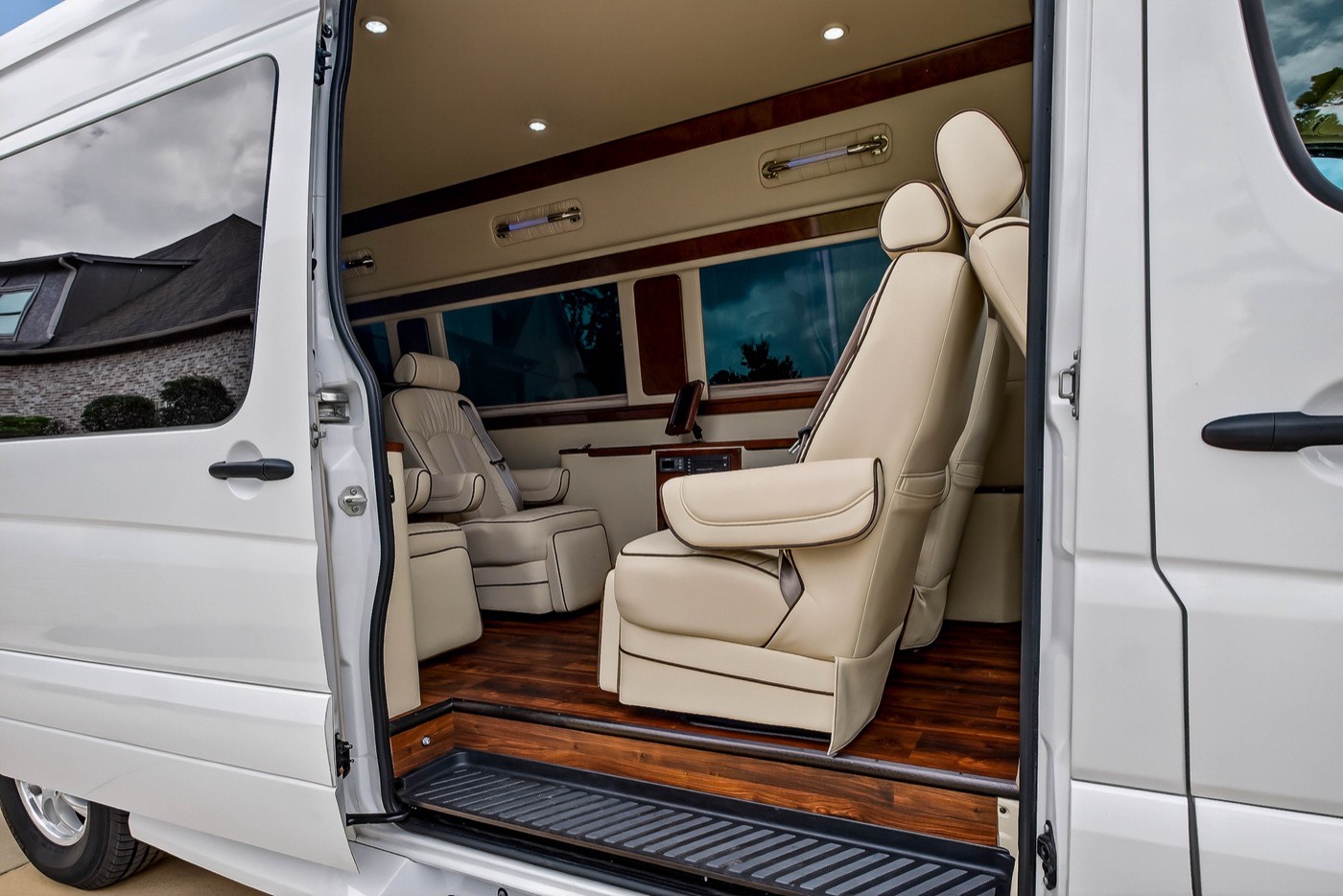 White Van — open-door view of cream leather captain's chairs